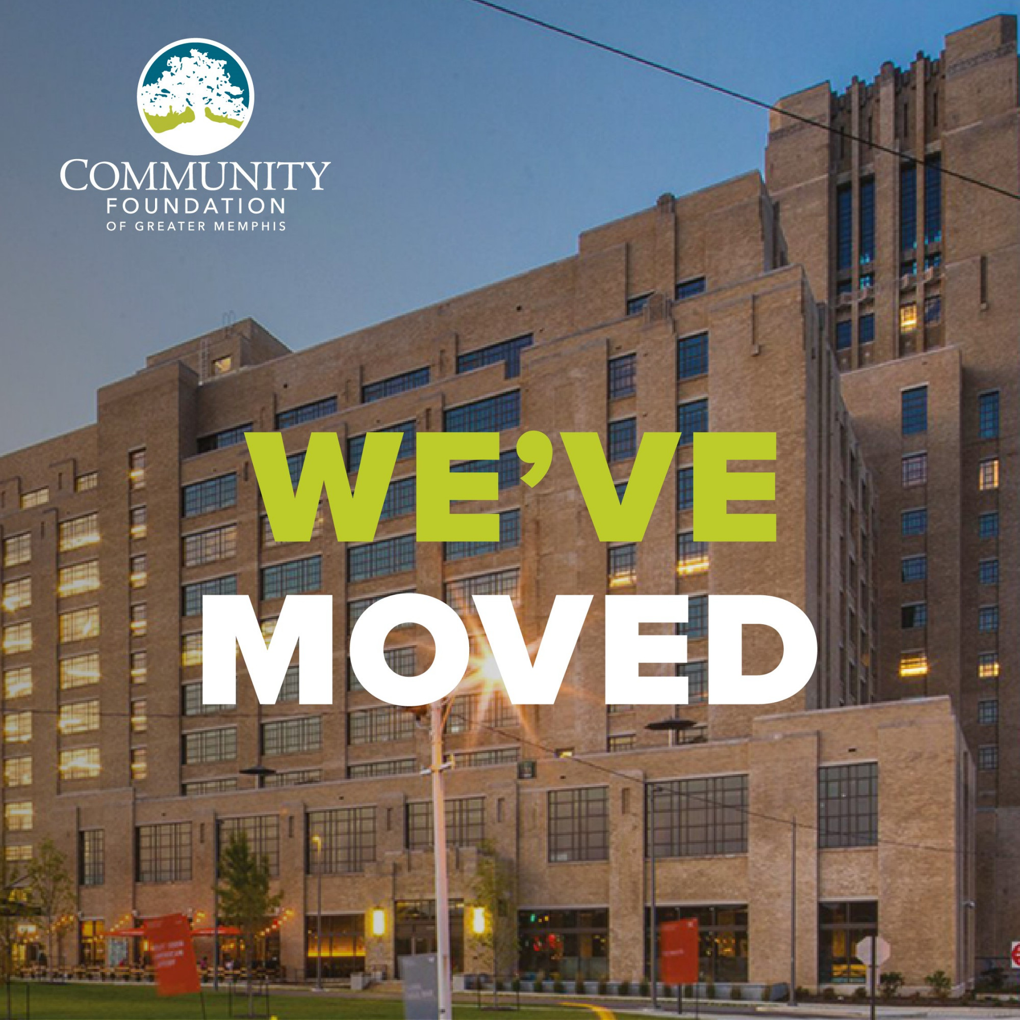 The Community Foundation of Greater Memphis logo over a photo of Crosstown Concourse at dusk, with bold text in the center reading WE’VE MOVED—highlighting our temporarily relocated office.