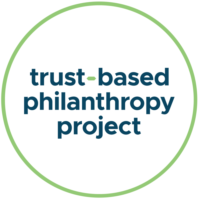Logo with a green circular border and the words trust-based philanthropy project in bold, dark blue lowercase letters centered inside. The hyphen in trust-based is green. The background is white.